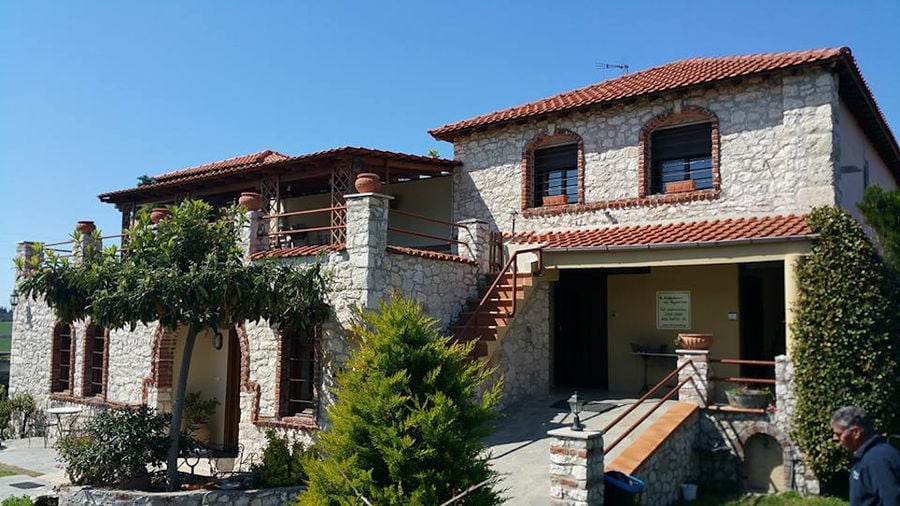 'Marianna' stone building with arcade entrance and windows and outside steps stairs